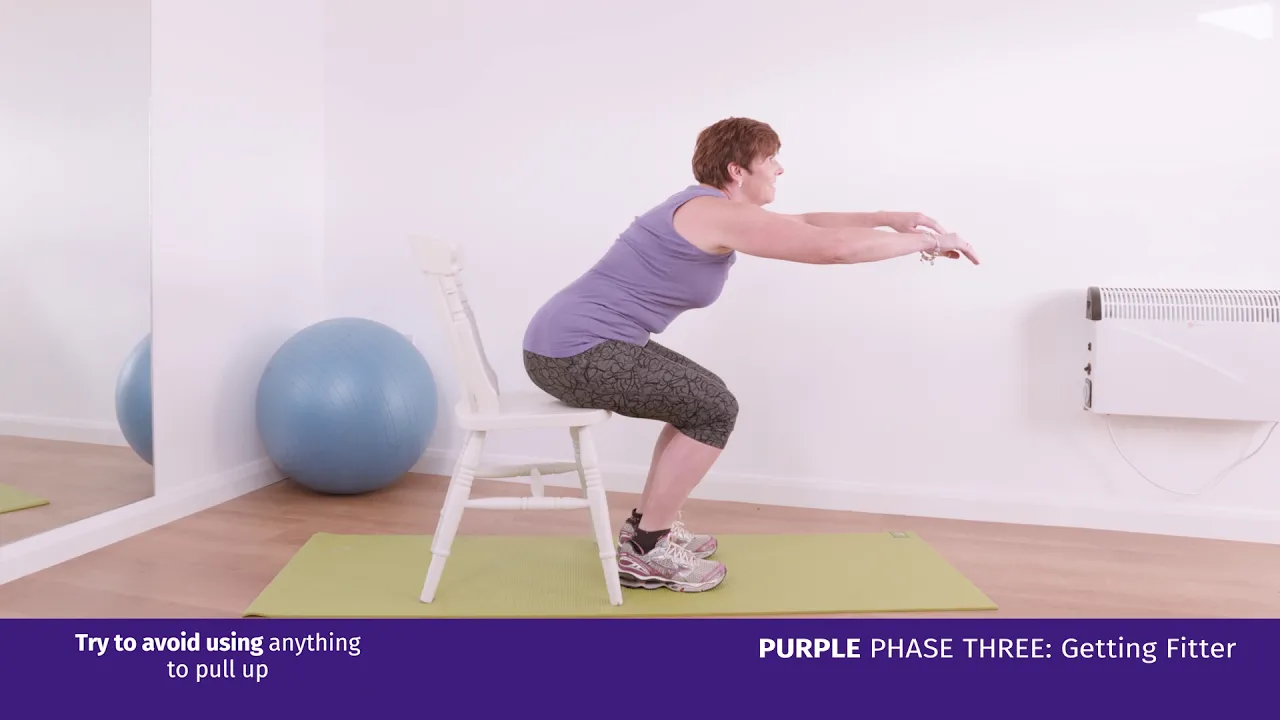 a woman doing an exercise on a chair