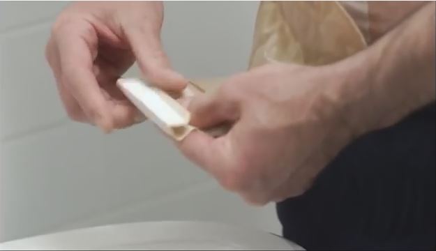 a person holding a white object