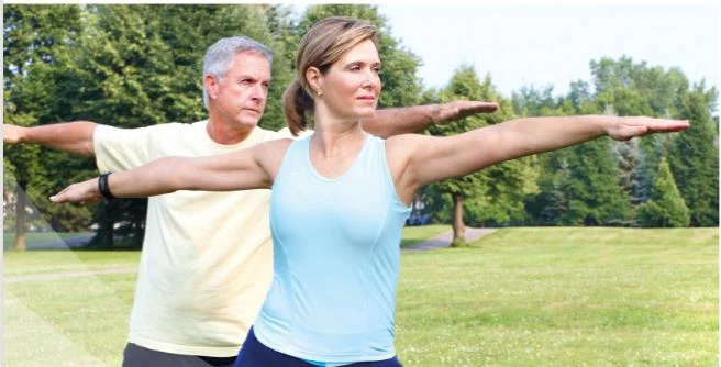 a man and a woman stretching their arms