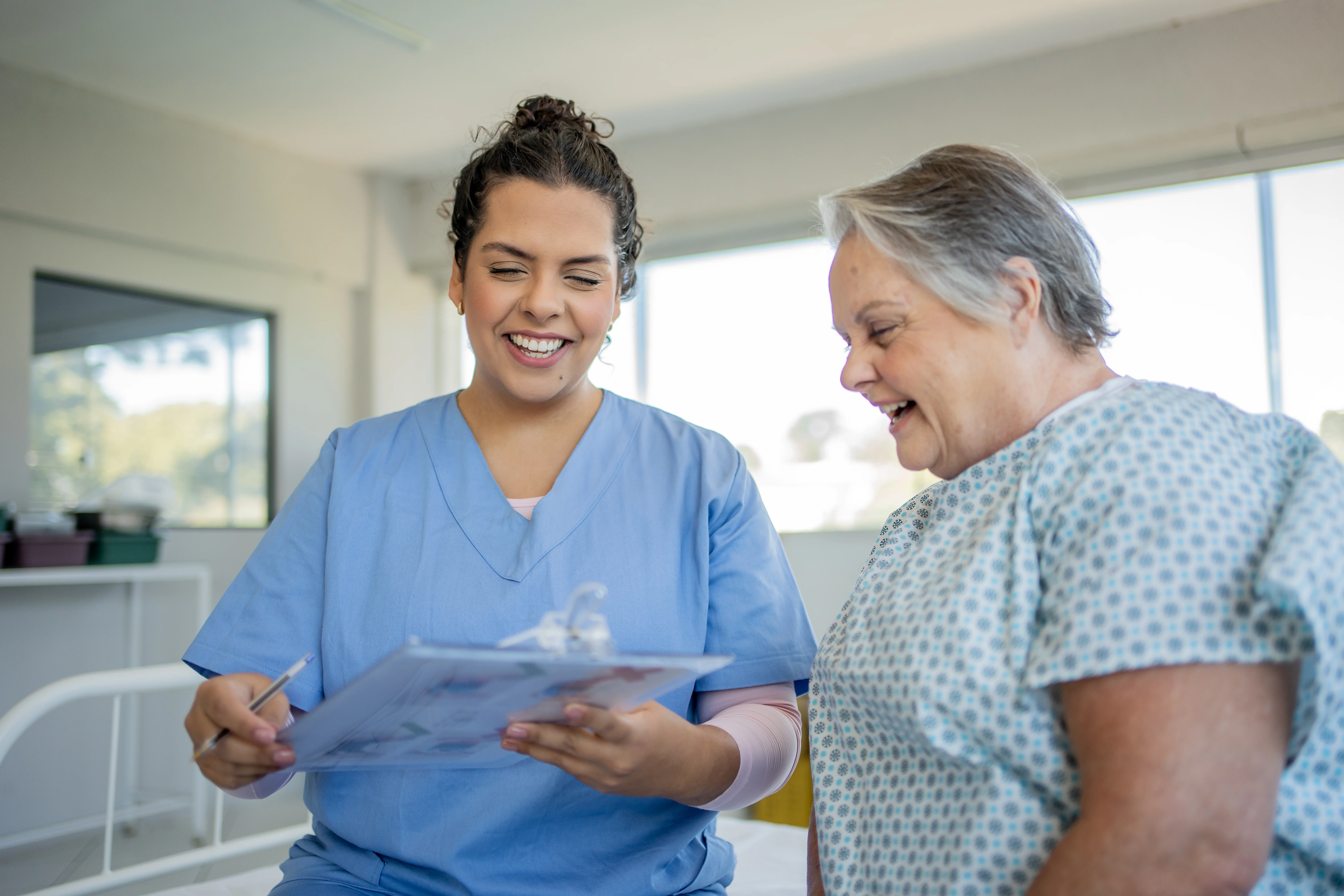 a nurse talking to a patient