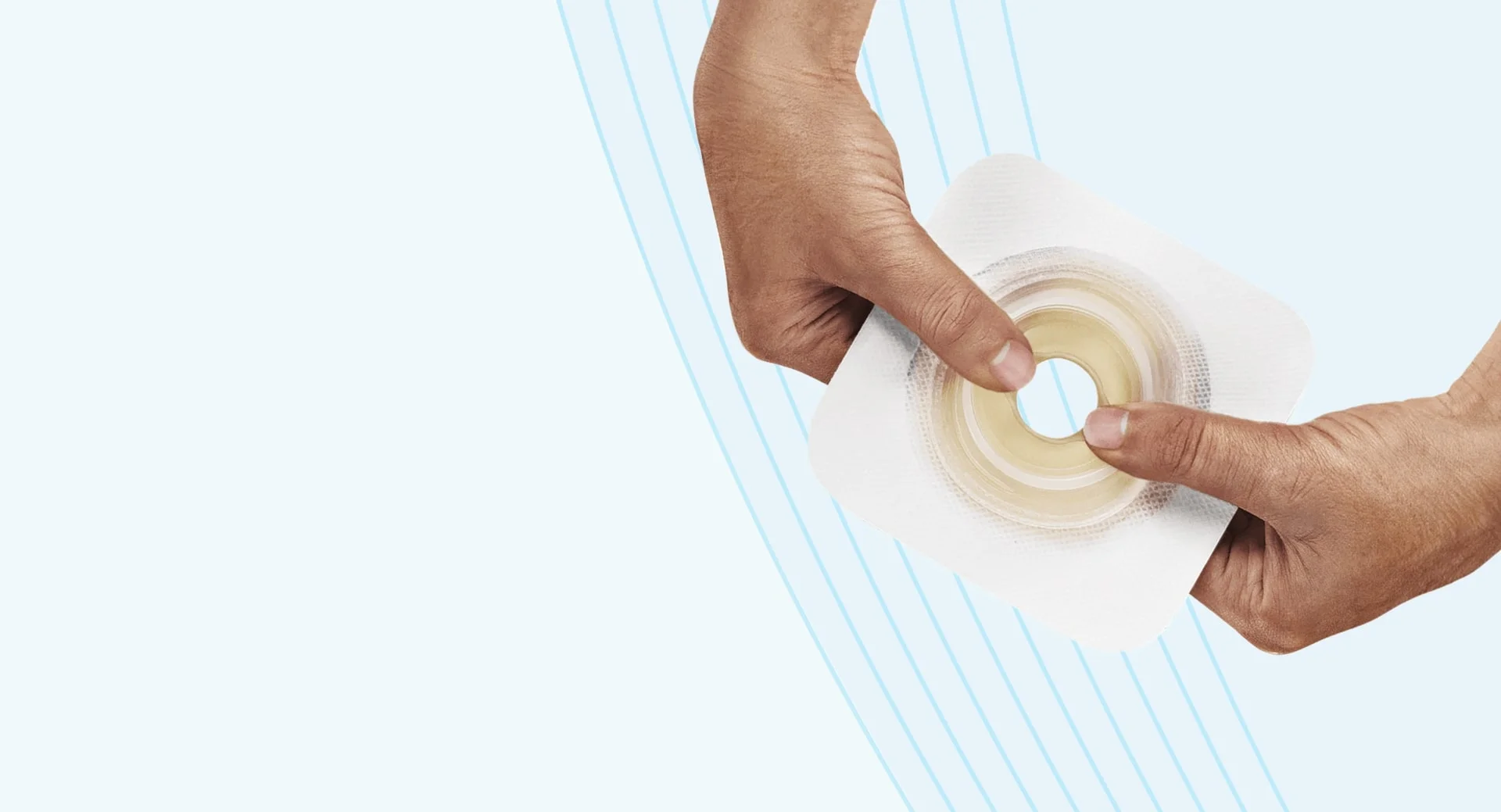 hands holding a skin barrier